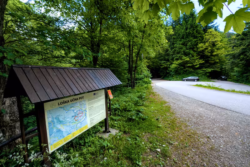 The parking area and information board.